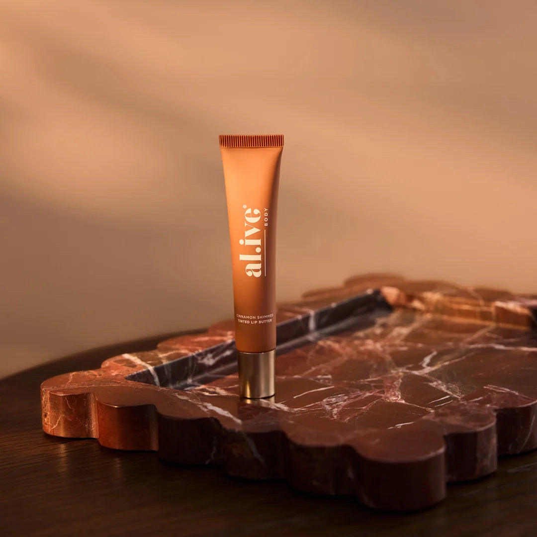al.ive body Tinted Lip Butter Ornament - Cinnamon & Citrus