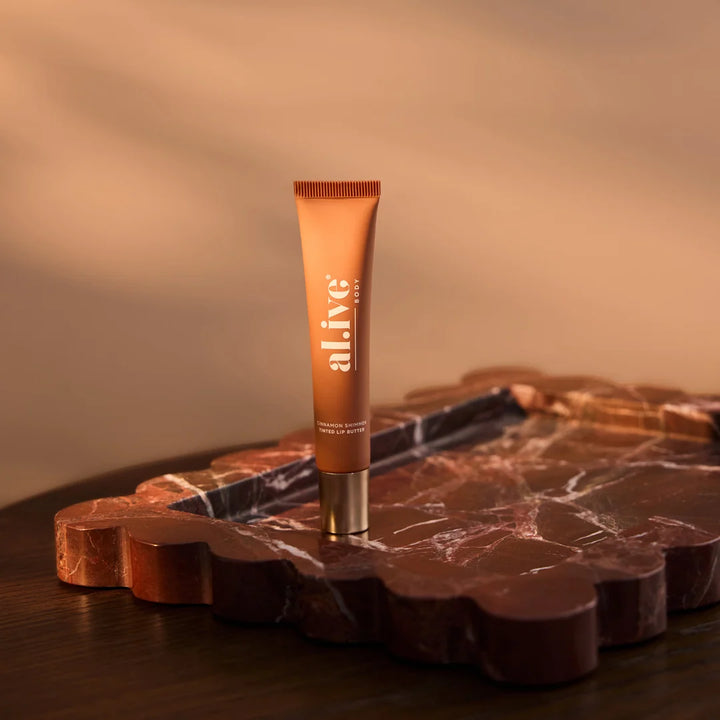al.ive body Tinted Lip Butter Ornament - Cinnamon & Citrus