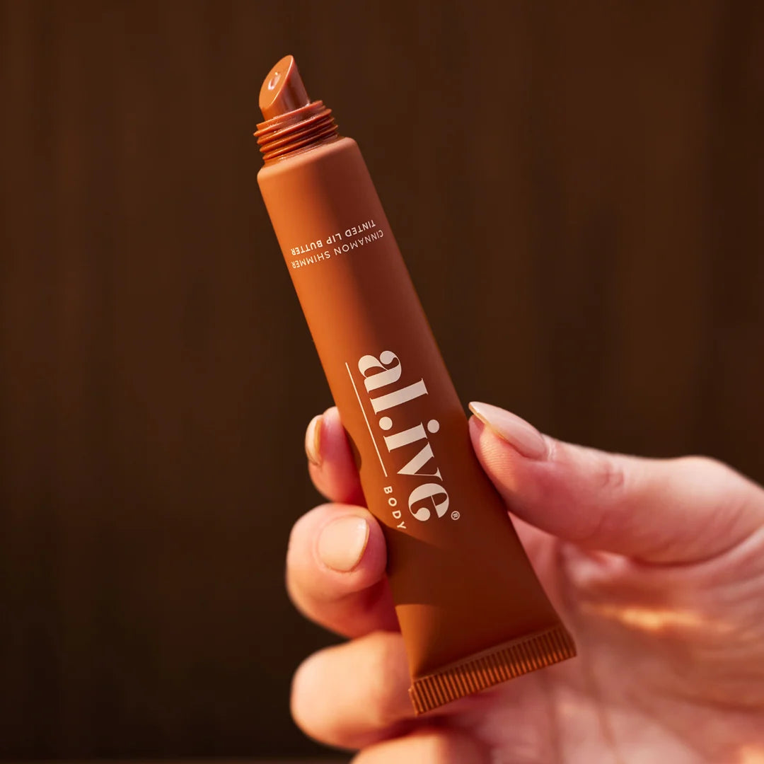 al.ive body Tinted Lip Butter Ornament - Cinnamon & Citrus